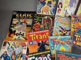 a lot of comic books that are on the table