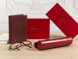 three glasses and a case sitting on top of a wooden table
