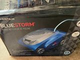 a box with a blue storm in it on the floor