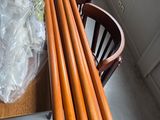 a table that has a bunch of wooden poles on it