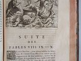 an open book with a picture of a man on a boat