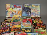 a lot of comic books that are on the table
