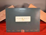 a black box with a label on it sitting on a red cloth