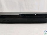 the sony playstation is sitting on top of a white table