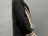 an image of a mannequin wearing a black and gold outfit
