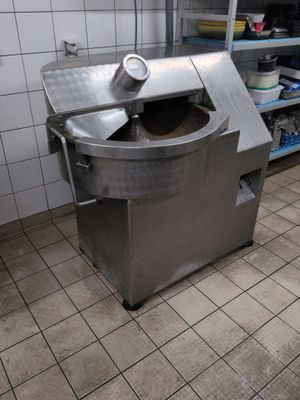 an image of a commercial kitchen with a large machine in it