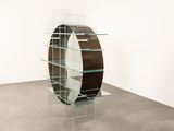 an image of a glass shelf in a room with a mirror on it