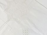a white table cloth with a star design on it