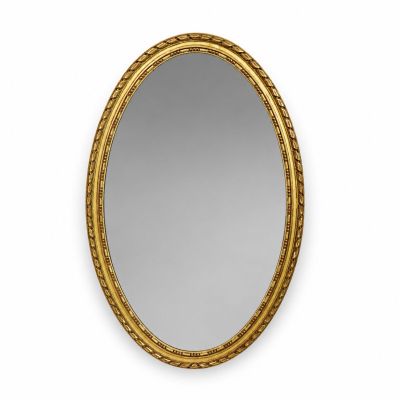 un miroir ovale doré accroché à un mur blanc