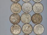 a close up of a bunch of coins sitting on top of a table