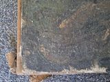an old book that is sitting on the ground