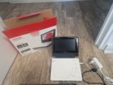 a laptop computer sitting on the floor next to a box