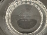a clear glass bowl with a writing on it