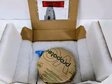 a cardboard box with a picture of a building inside of it