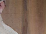 painting of a man in a white shirt and a black hat