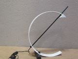 a lamp that is sitting on a table next to a charger
