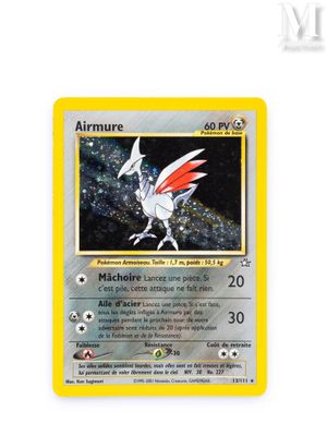 a close up of a pokemon card on a white surface