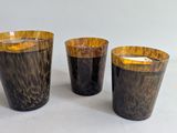 three candles that are sitting on a table