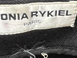 a close up of a black jacket with a label on it