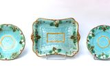 three pieces of blue and green dishes with gold trims