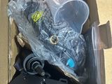 a cardboard box filled with assorted items on the floor