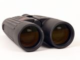 a pair of binoculars sitting on a white surface