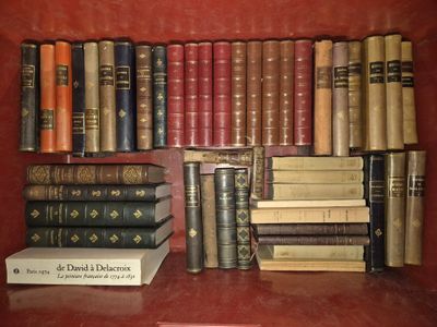 many books that are on a shelf in a book case