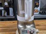 a blender that is sitting on a wooden table