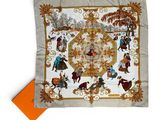 a square scarf with a picture of people on it