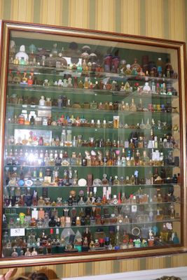 a picture of a man standing in front of a large display case