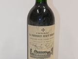 a bottle of wine that is sitting on a table