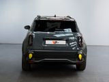 the rear end of a grey suv parked in a showroom