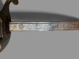 a sword that is on display on a table