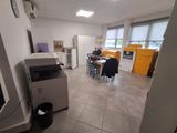 an image of a room with a printer and a table