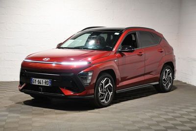 the red suv is parked in a large room with checkered flooring