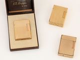 an image of a gold cigarette case and lighter in a box