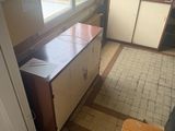 a view of a kitchen from the window of a house