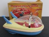 a small toy airplane with a box in the background