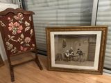 a picture of two people sitting at a table in front of a picture