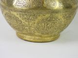 a large gold vase with intricate designs on it