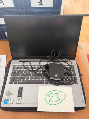 a laptop computer sitting on top of a wooden table