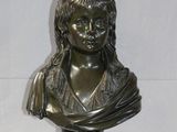 bronze bust of a young girl on a marble base