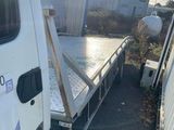 a white truck with a flat bed on the back of it