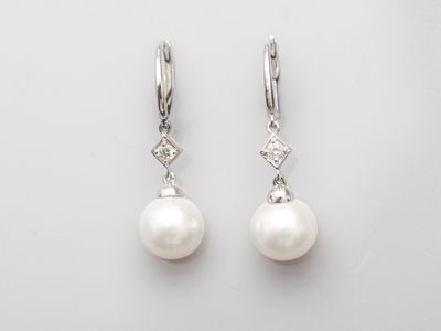 Paire de dormeuses en or gris 750°/°° (18K), serties de perl… - Photo 1