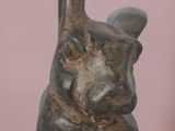 a statue of a rabbit that is sitting on a table