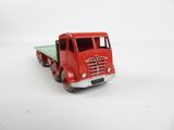 a toy truck that is sitting on a white surface