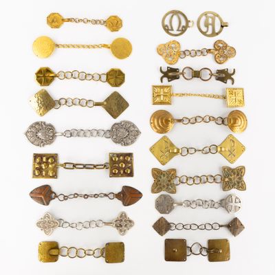 an assortment of antique and modern metal bracelets and brooches