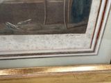 a picture of a painting on the wall of a bedroom