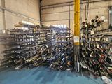 a large pile of pipes and pipes in a warehouse