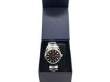 a watch in a black box on a white background